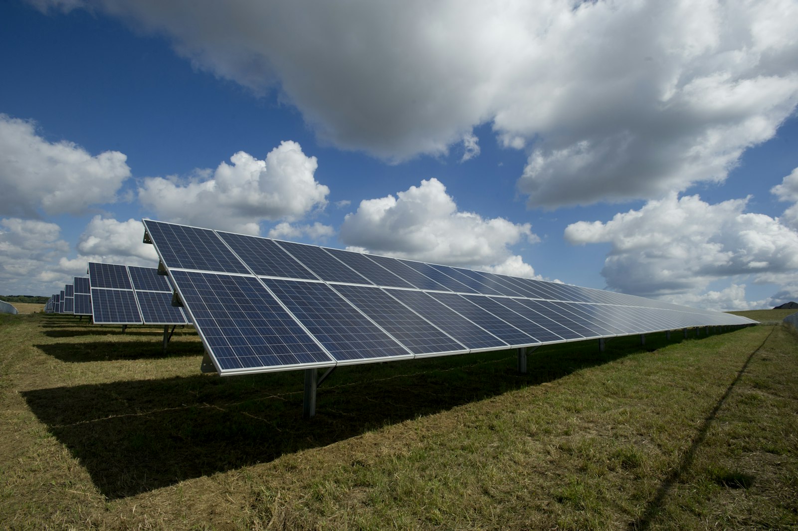Ground-mounted photovoltaic array under blue sky